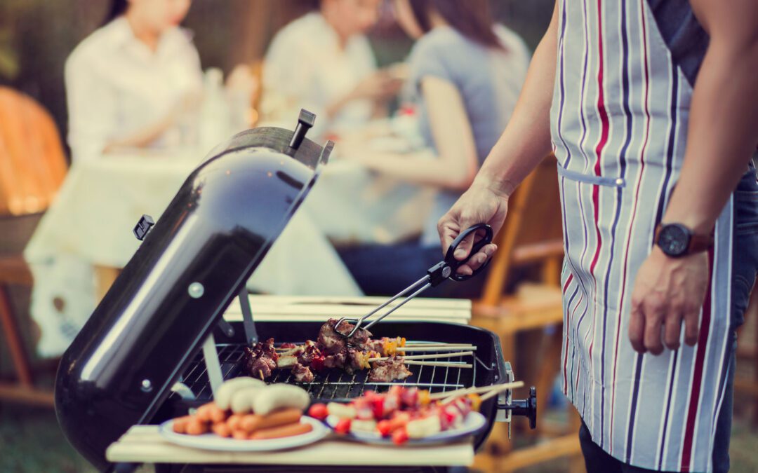 Asian men are cooking for a group of friends to eat barbecue